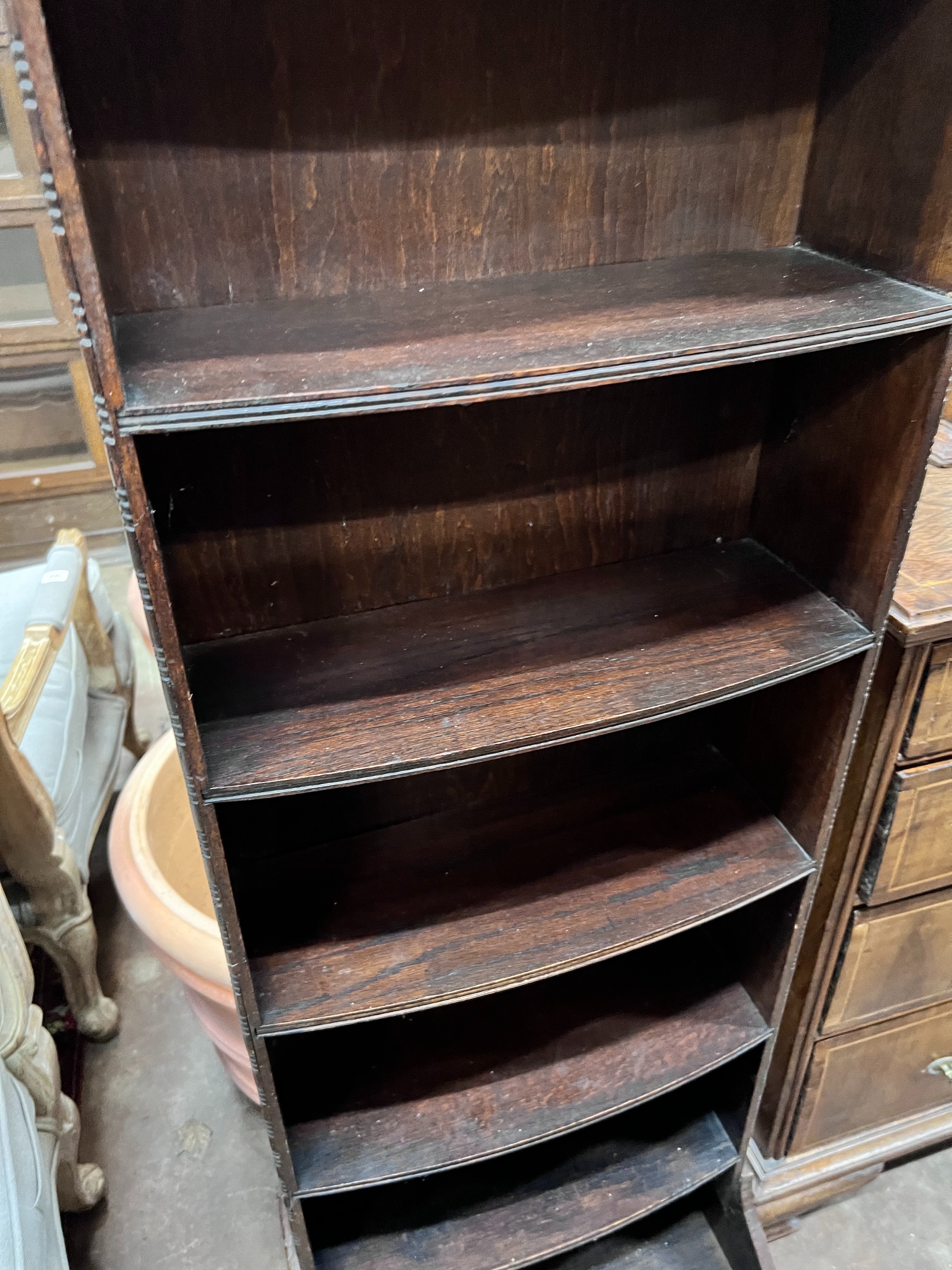 A 1920's oak narrow eight shelf open bookcase, width 49cm, depth 30cm, height 161cm *Please note the sale commences at 9am.